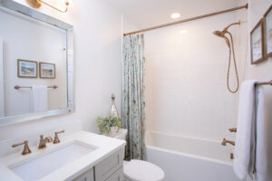 Subway tile surrounds the new square-edged tub.
