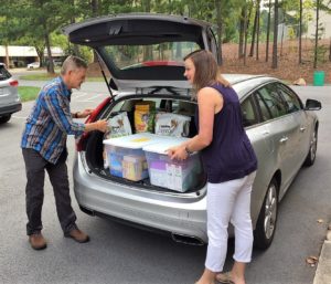 Hank and Kathy loading up supplies for Hurricane Florence Airdrop.